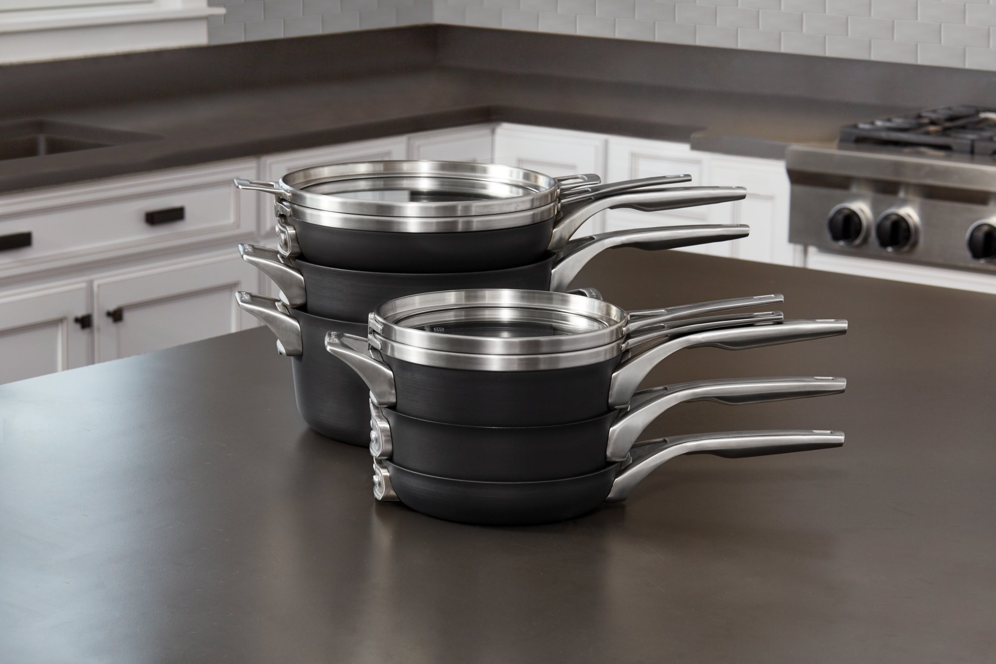 KNIVES AND TOOLS -KNIVES AND TOOLS 2010637 16calphalon premier space saving nonstick cookware hard anodized 10pc set in use 2